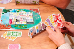 Zoch Ananda - A strategic board game with meditative influences, temple building using tactics, monks meditating in colored areas, collecting karma points, family game for ages 10 and up.