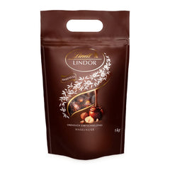 LINDOR chocolate balls with hazelnuts, 1 kg bag + Johnnie Walker Sherry barrel 0.7 liters