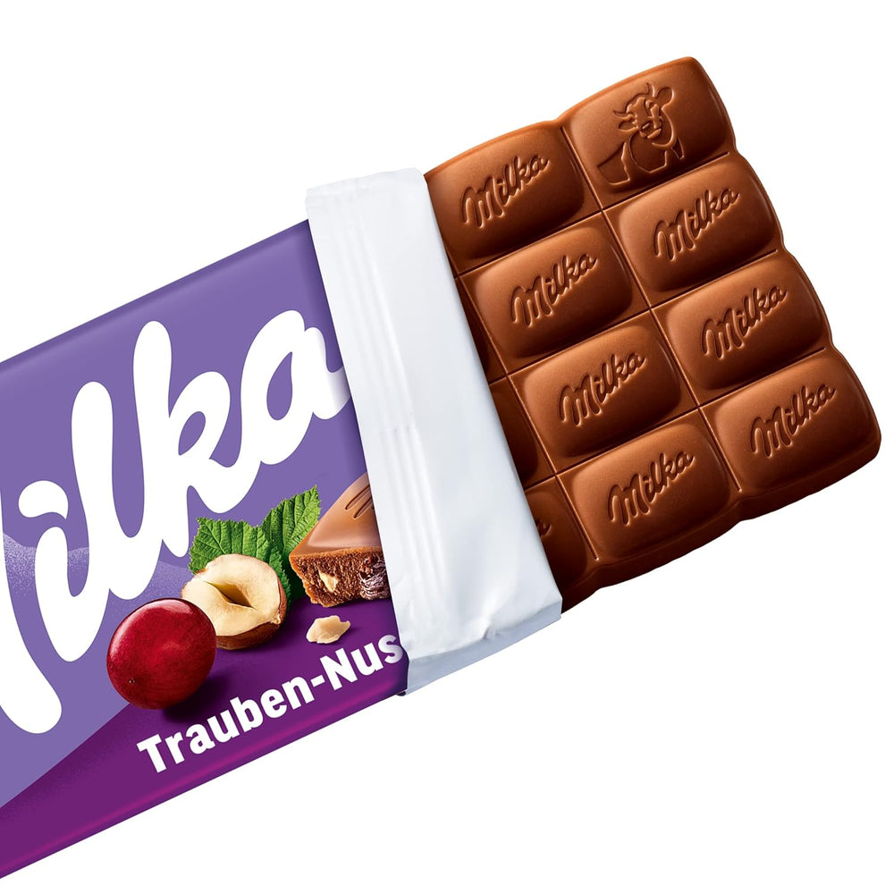 Milka Grapes and Hazelnuts – Alpine milk chocolate with pieces of hazelnuts and raisins – 90g
