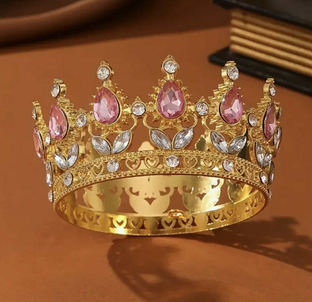 Golden metal crown with pink stones