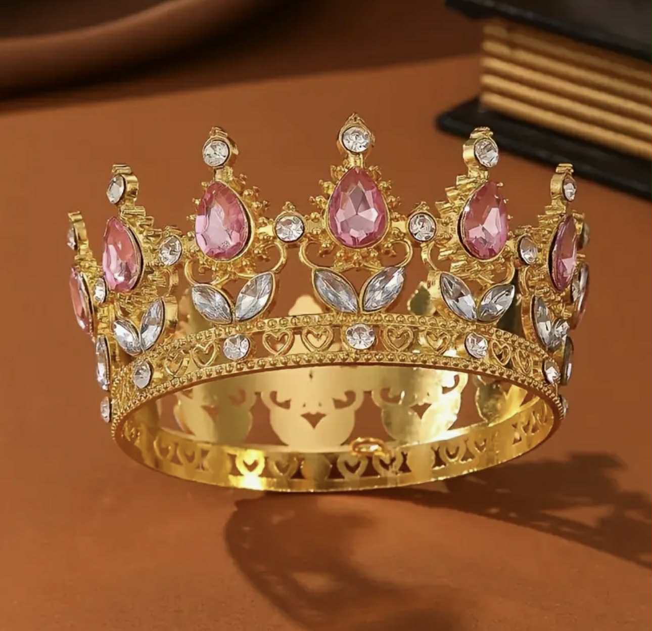 Golden metal crown with pink stones